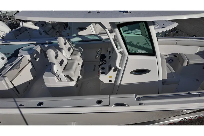 Slide: The Image of 2026 Sailfish 272 CC boat interior with seating and steering console. - 10