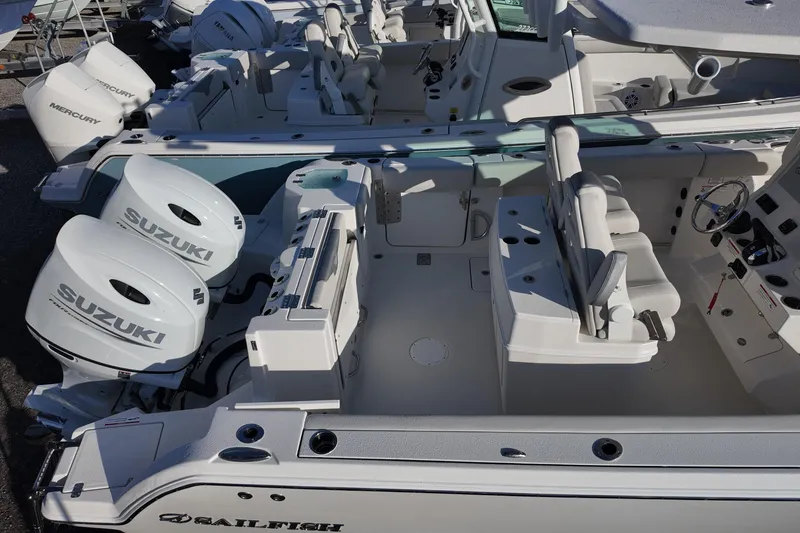 Slide: The Image of 2026 Sailfish 272 CC boat with dual Suzuki outboard engines, spacious seating, and modern controls. - 11