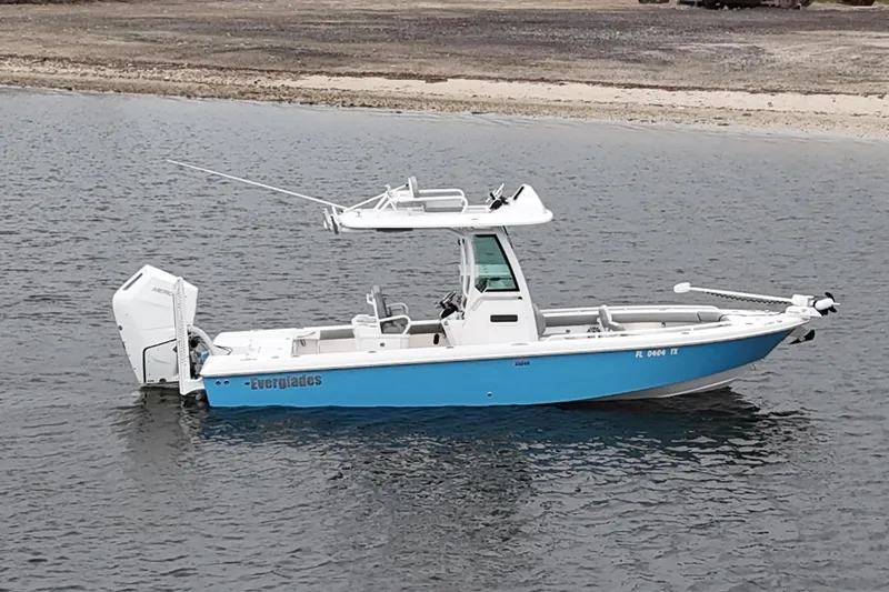 Slide: The Image of 2024 Everglades 253 Center Console boat on water, featuring sleek design and modern amenities. - 14