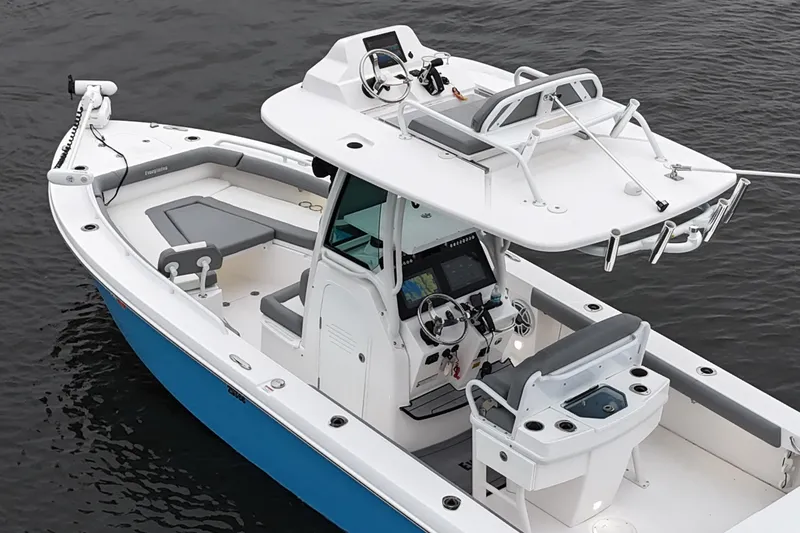 Slide: The Image of 2024 Everglades 253 Center Console boat on water, featuring modern design and advanced navigation systems. - 17