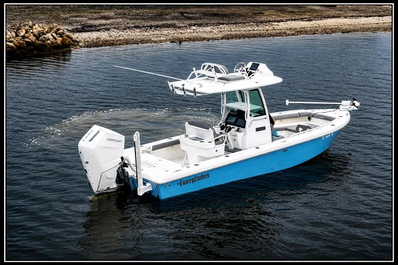 Slide: The Image of 2024 Everglades 253 Center Console boat on water, featuring sleek design and modern equipment. - 18