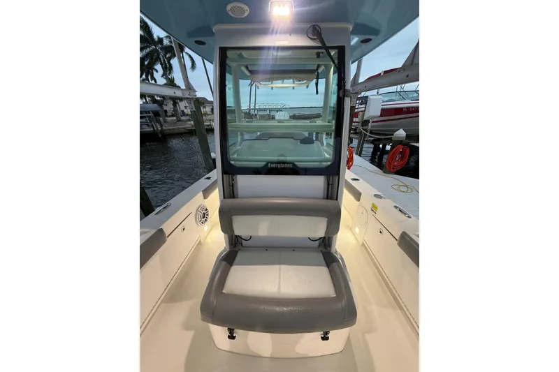 Slide: The Image of 2024 Everglades 253 Center Console boat interior with seating and console view. - 32