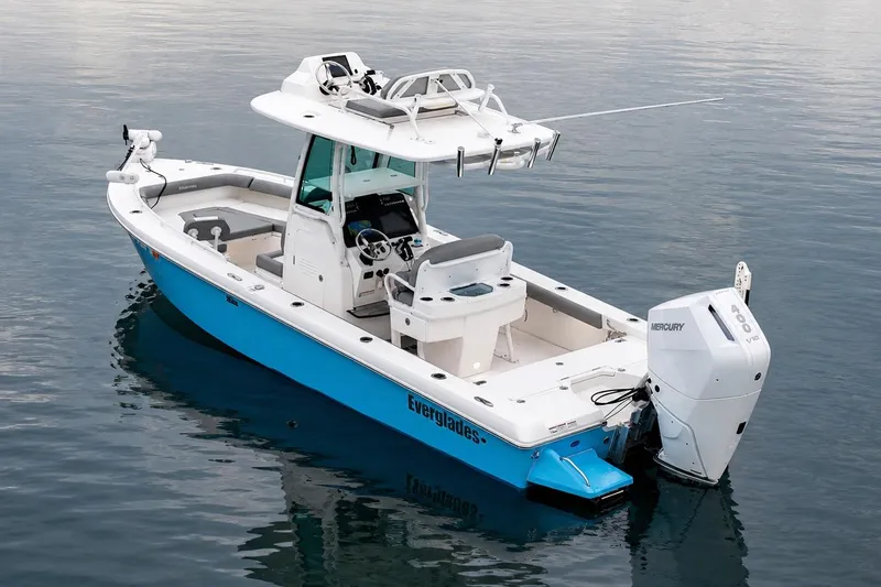 Slide: The Image of 2024 Everglades 253 Center Console boat on calm water, featuring a sleek design. - 37