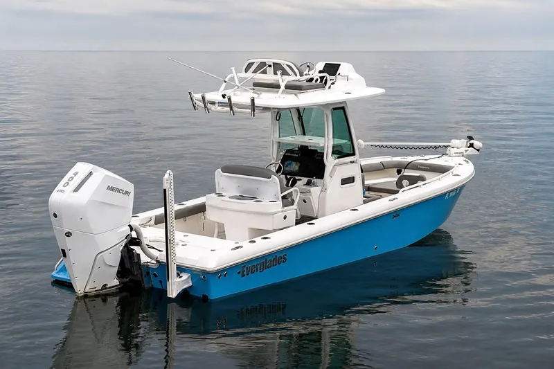 Slide: The Image of 2024 Everglades 253 Center Console boat on calm water, featuring a Mercury engine. - 40