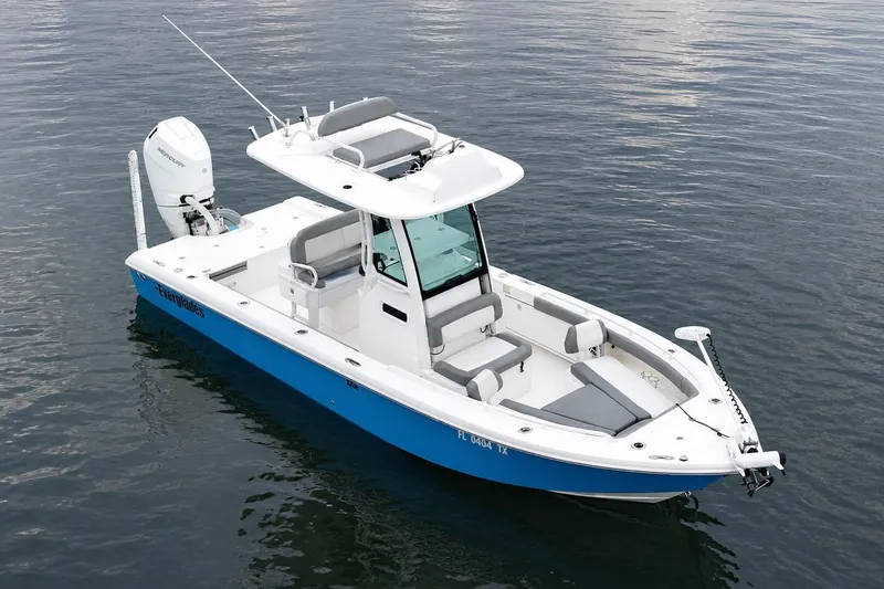 Slide: The Image of 2024 Everglades 253 Center Console boat on calm water, featuring sleek design and modern amenities. - 7