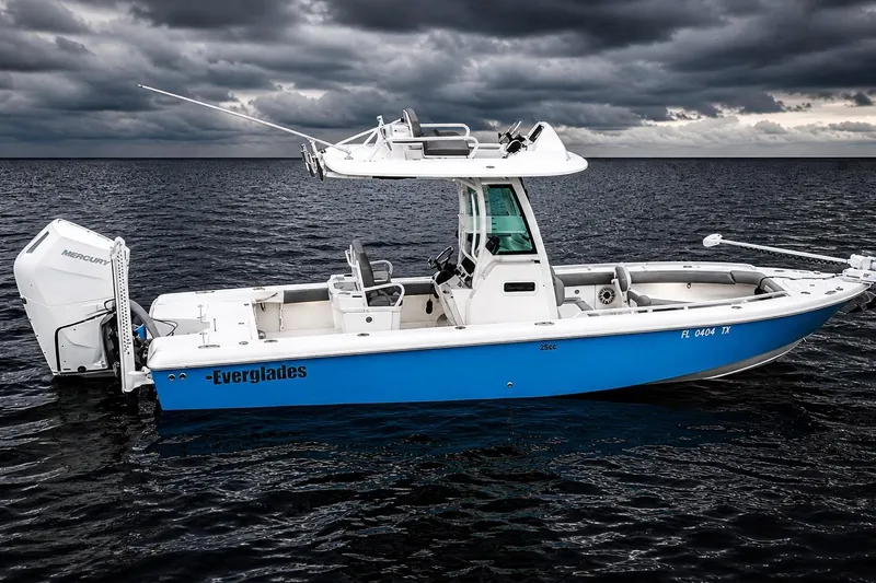 Slide: The Image of 2024 Everglades 253 Center Console boat on water under cloudy sky. - 8