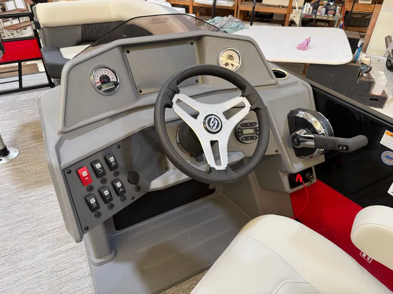 Slide: The Image of 2026 Sylvan R-22 CLZ DH helm with steering wheel and controls. - 11