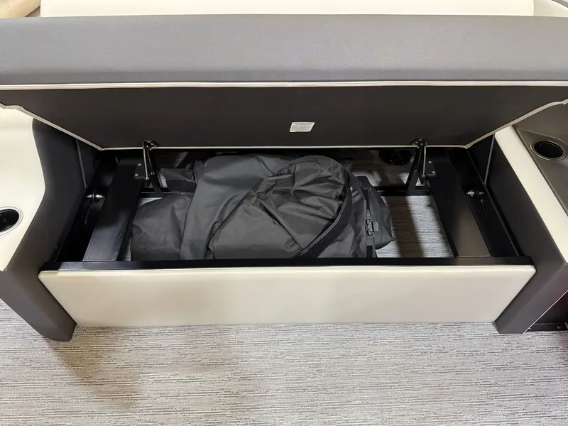 Slide: The Image of Sylvan R-22 CLZ DH 2026 seat storage with bag inside. - 19