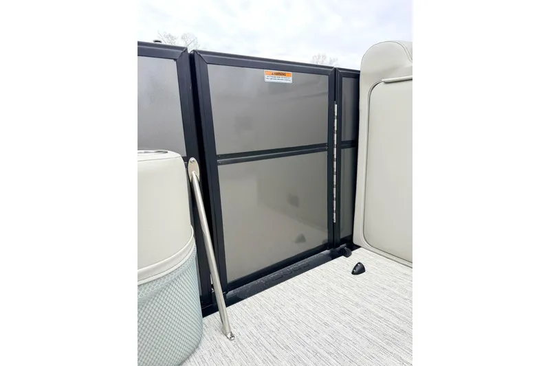 Slide: The Image of 2026 Coach Pontoons 223 RFC interior gate detail with sleek design and modern finish. - 15