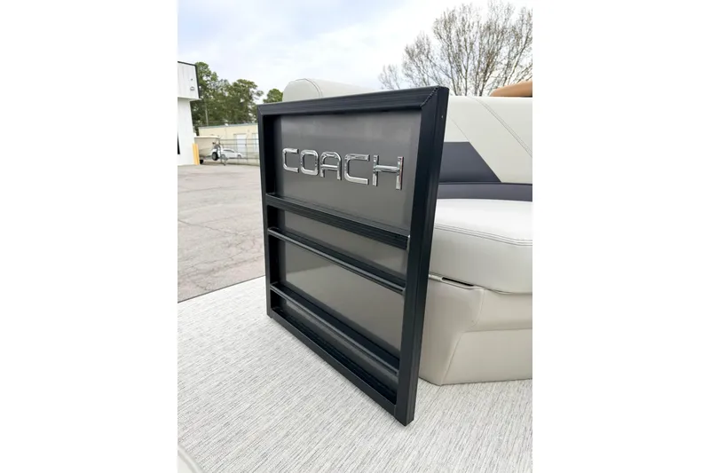 Slide: The Image of 2026 Coach Pontoons 223 RFC logo on boat interior, showcasing luxury seating. - 17