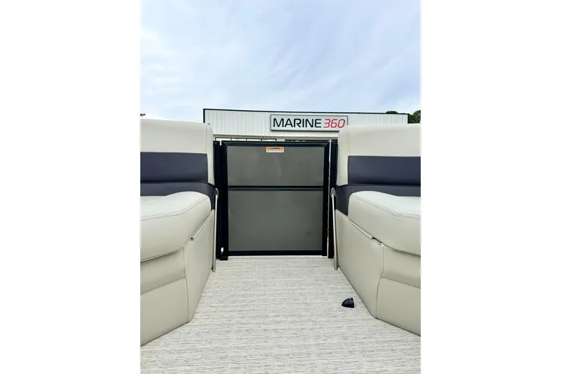 Slide: The Image of 2026 Coach Pontoons 223 RFC interior with seating and storage, Marine 360 backdrop. - 18