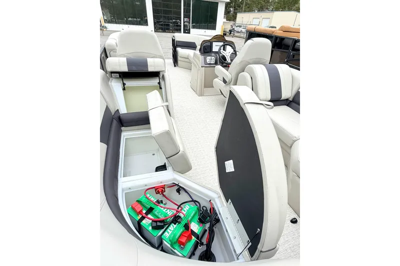 Slide: The Image of 2026 Coach Pontoons 223 RFC interior with open storage compartments and seating. - 8