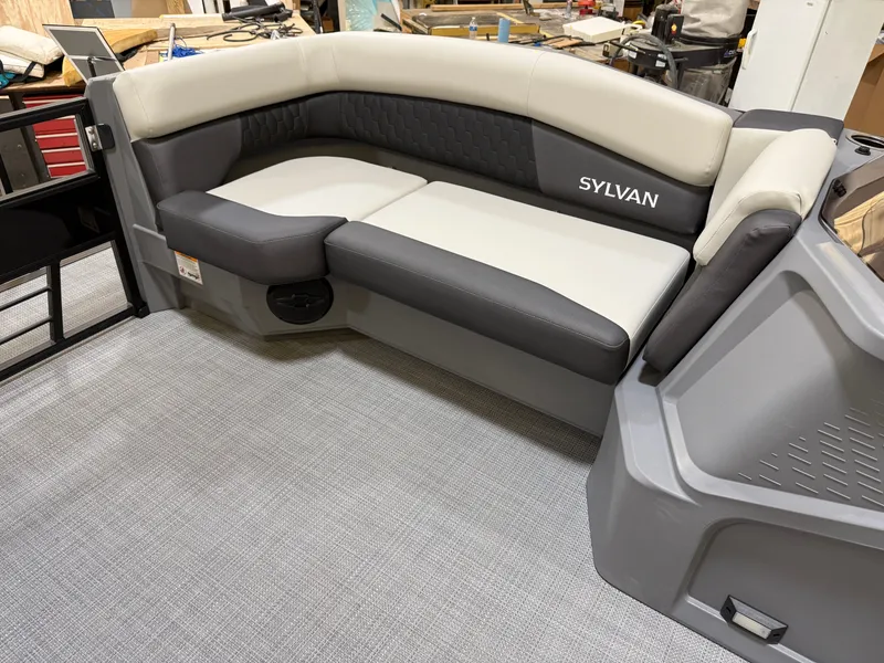 Slide: The Image of Sylvan R-22 LZ DH 2026 boat seating in workshop setting. - 7