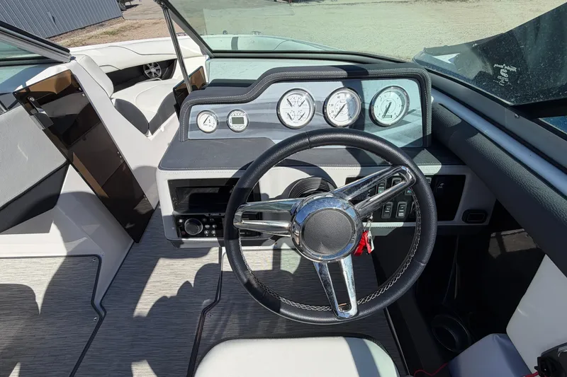 Slide: The Image of 2019 Regal 2300 Bowrider dashboard with steering wheel and instrument panel. - 10