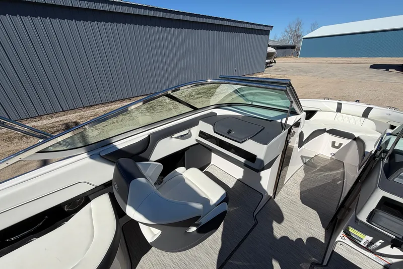 Slide: The Image of 2019 Regal 2300 Bowrider interior with sleek seating and modern dashboard design. - 11