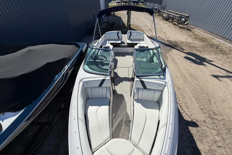 Slide: The Image of 2019 Regal 2300 Bowrider boat with spacious seating and sleek design. - 13