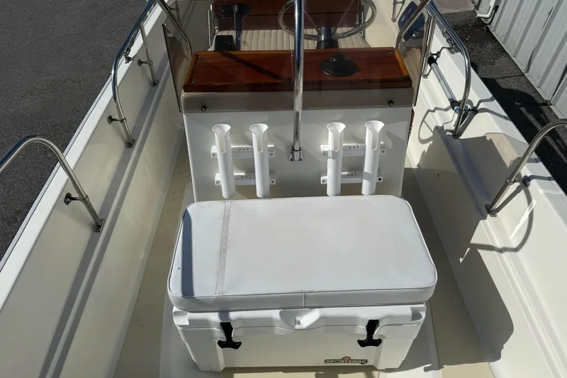 Slide: The Image of 1978 Boston Whaler 17 Montauk interior with seating and rod holders. - 10