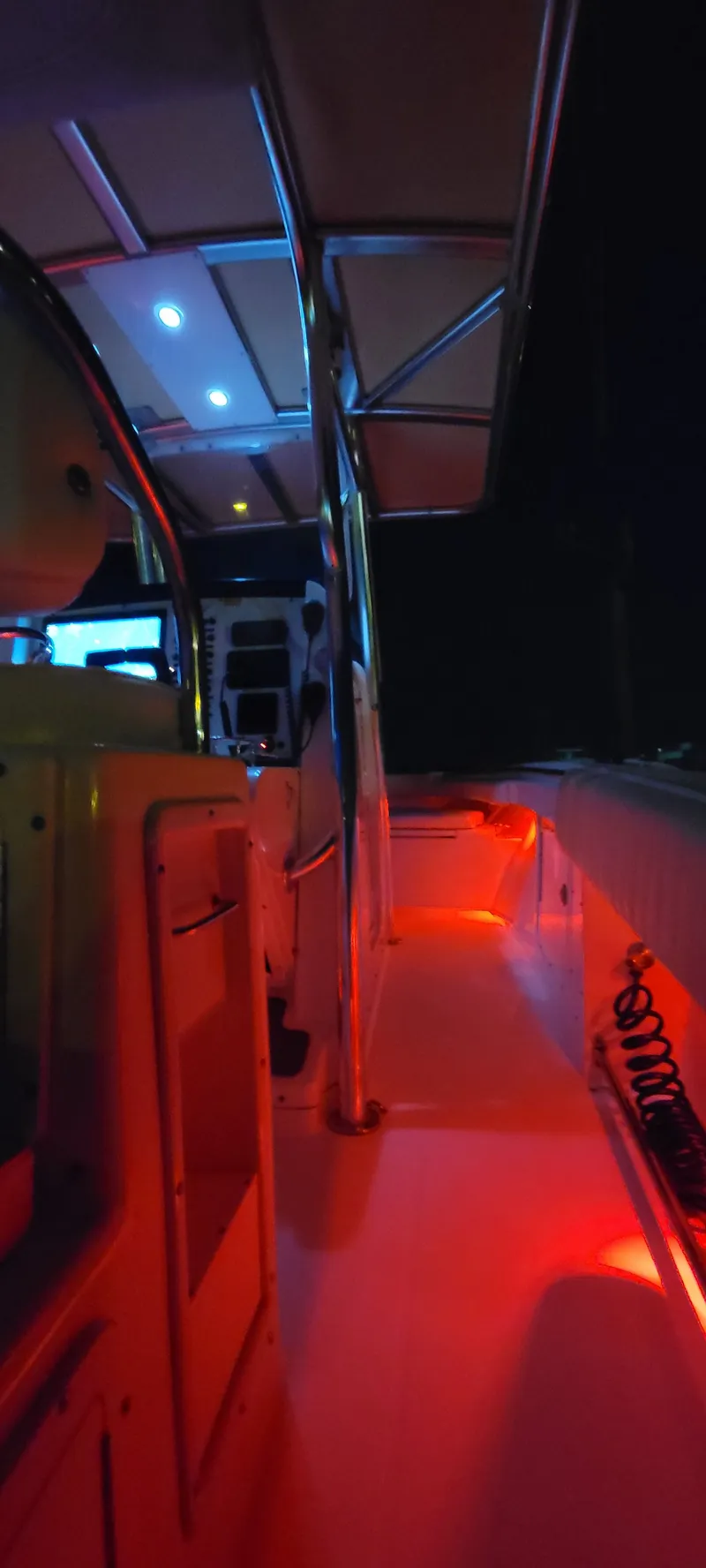Slide: The Image of Interior view of illuminated Southport Center Console 26 boat at night. - 7