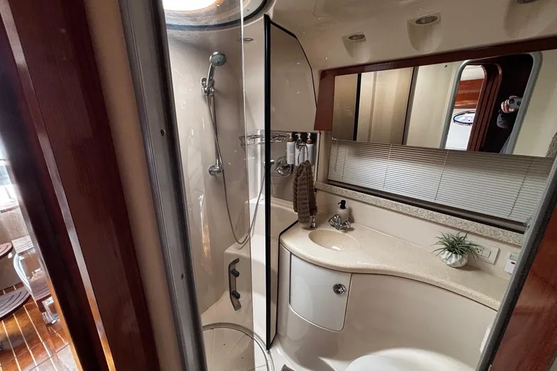 Slide: The Image of Luxurious bathroom in 2006 Regal Commodore 3860 yacht with modern fixtures and elegant design. - 3