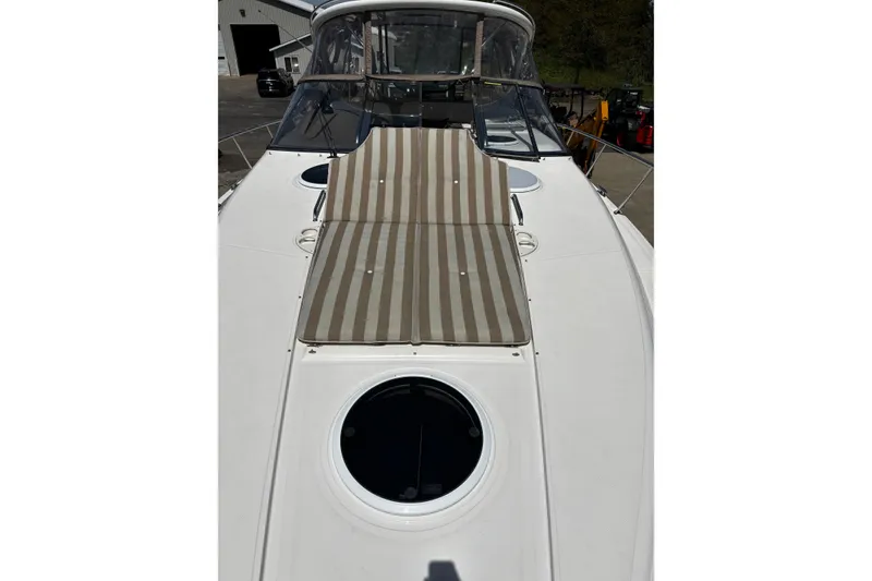 Slide: The Image of 2006 Regal Commodore 3860 yacht with striped sunbed on deck. - 31