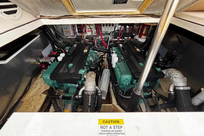 Slide: The Image of Engine room of a 2006 Regal Commodore 3860 with dual engines and wiring. - 37