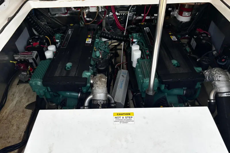 Slide: The Image of Engine compartment of a 2006 Regal Commodore 3860 boat, featuring dual engines. - 38