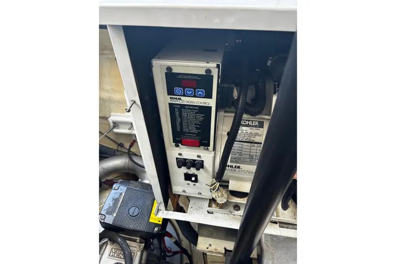 Slide: The Image of Engine control panel of a 2006 Regal Commodore 3860 boat, featuring Kohler power system. - 39