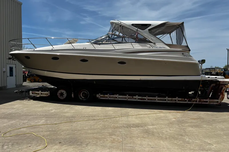 Slide: The Image of 2006 Regal Commodore 3860 yacht on trailer under clear blue sky. - 44
