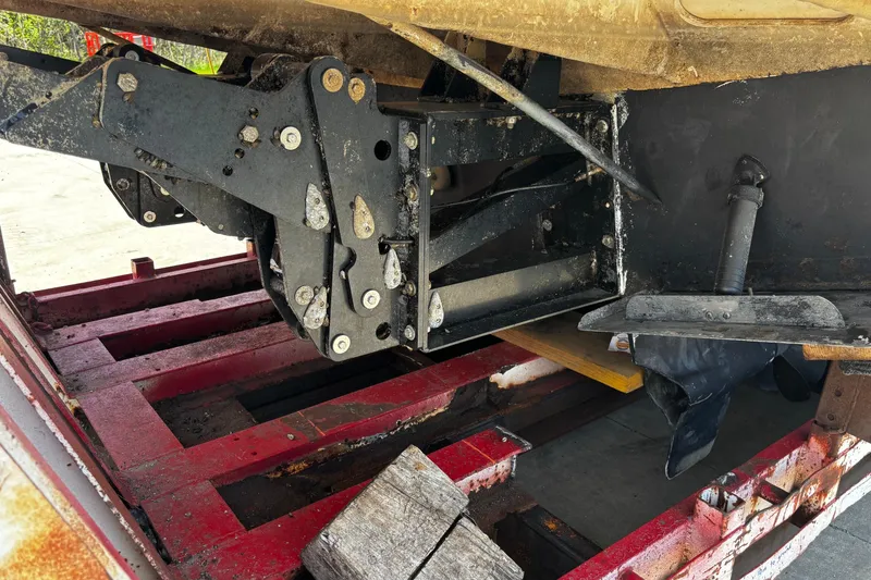 Slide: The Image of Underside view of a 2006 Regal Commodore 3860 boat on a red trailer. - 49
