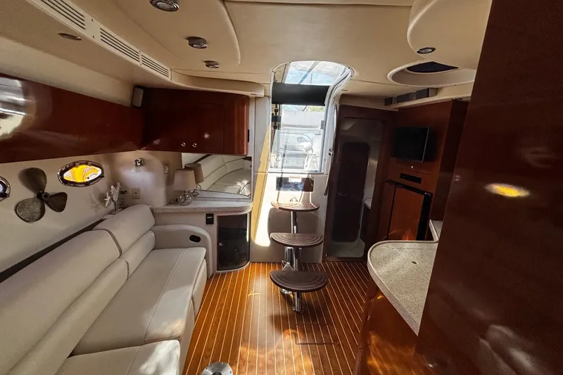 Slide: The Image of Luxurious interior of a 2006 Regal Commodore 3860 yacht with elegant wood finishes. - 5