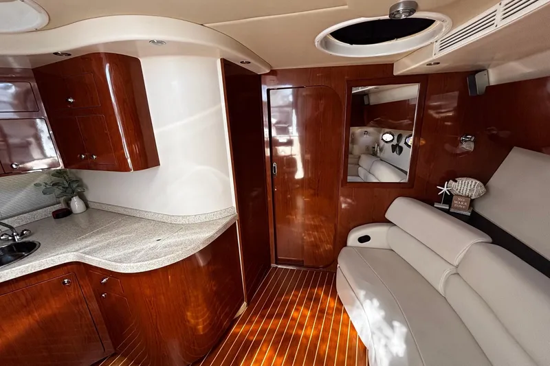 Slide: The Image of Luxurious interior of 2006 Regal Commodore 3860 yacht with wood finish and modern amenities. - 8