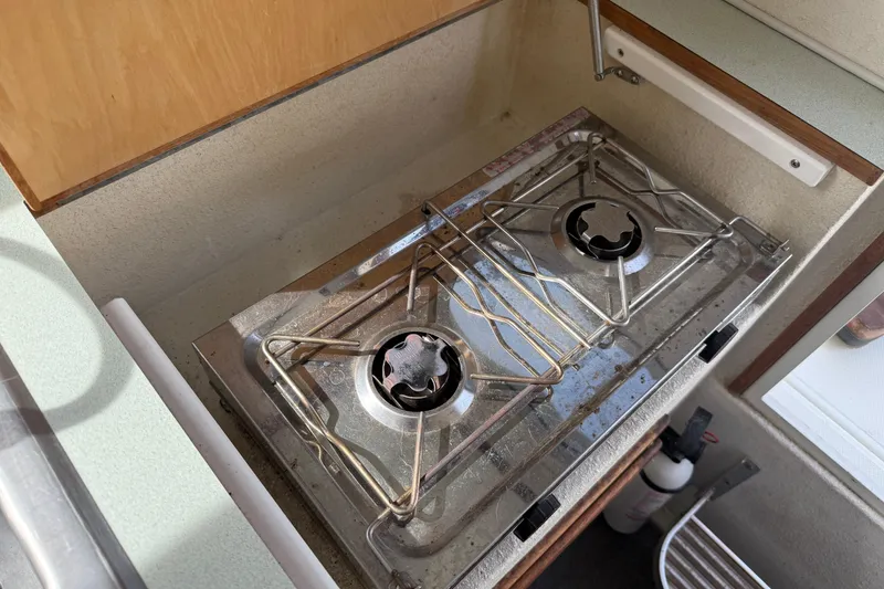 Slide: The Image of Two-burner stove in 2005 SeaSport Explorer 2400 boat kitchen area. - 14