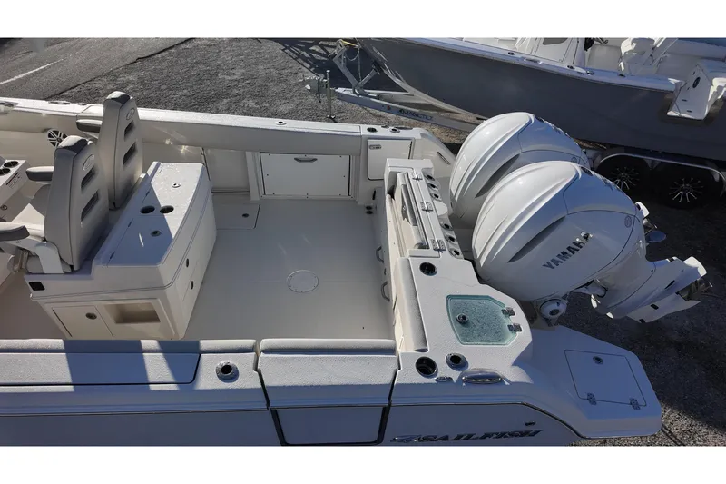 Slide: The Image of 2026 Sailfish 272 CC boat with dual Yamaha outboard engines, spacious deck, and seating. - 10