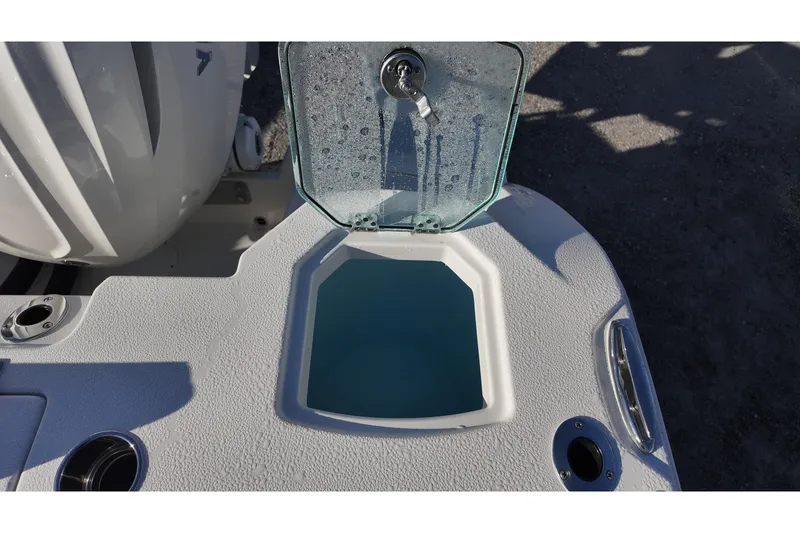 Slide: The Image of Livewell on 2026 Sailfish 272 CC boat, open lid, showing interior. - 14
