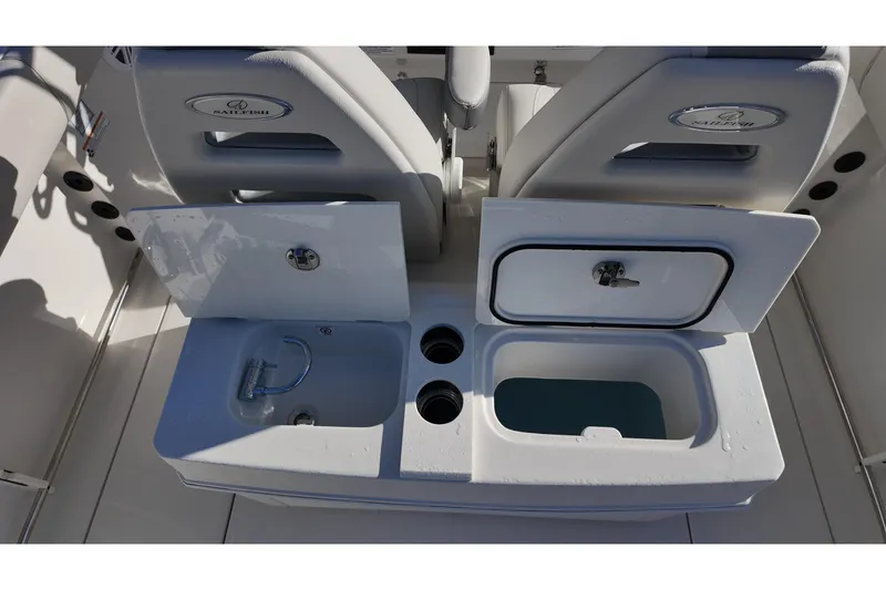 Slide: The Image of 2026 Sailfish 272 CC boat interior with open storage compartments and sink. - 16