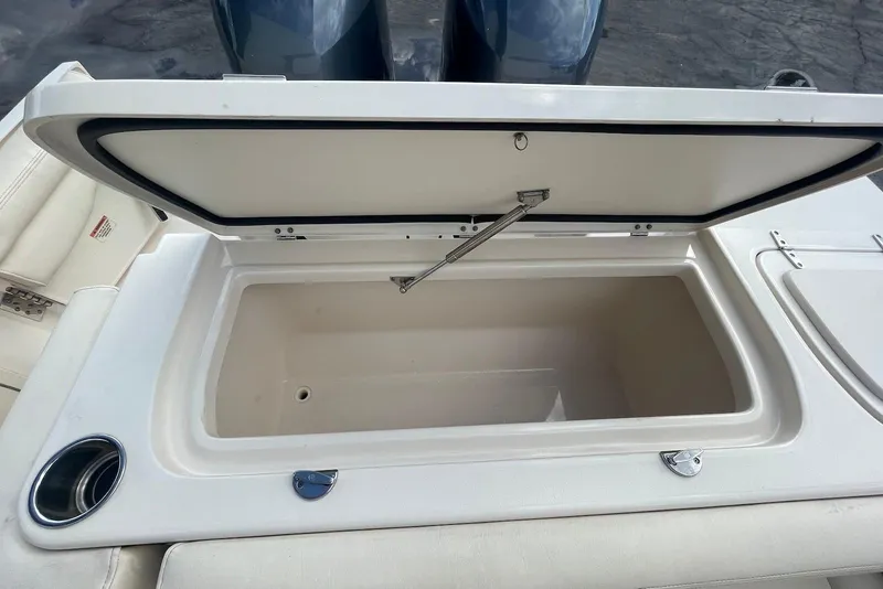 Slide: The Image of Open storage compartment on a 2015 Grady-White Freedom 275 boat. - 18