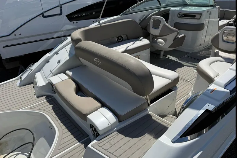 Slide: The Image of 2019 Crownline Eclipse E235 XS boat interior with plush seating and modern design. - 10