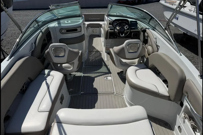 Slide: The Image of 2019 Crownline Eclipse E235 XS boat interior with seating and steering console. - 11