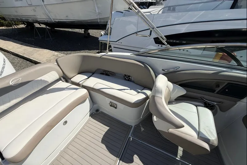 Slide: The Image of 2019 Crownline Eclipse E235 XS boat interior with plush seating and modern design. - 21