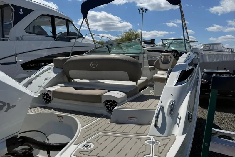 Slide: The Image of 2019 Crownline Eclipse E235 XS boat with spacious seating and modern design. - 5