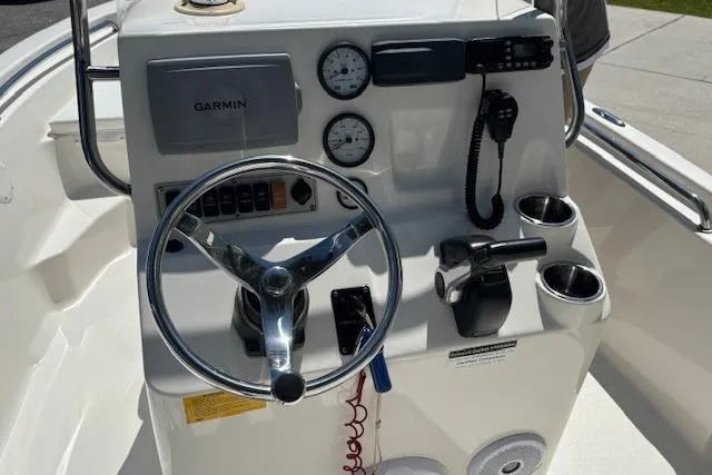 Slide: The Image of 2013 Key West 189 FS boat console with Garmin GPS, gauges, and radio. - 17