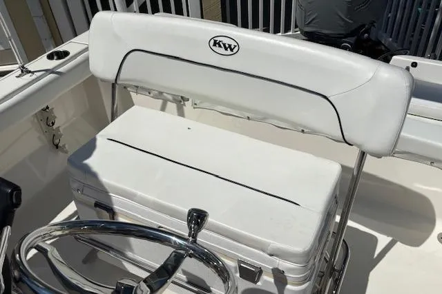 Slide: The Image of White seating area on a 2013 Key West 189 FS boat with steering wheel. - 19