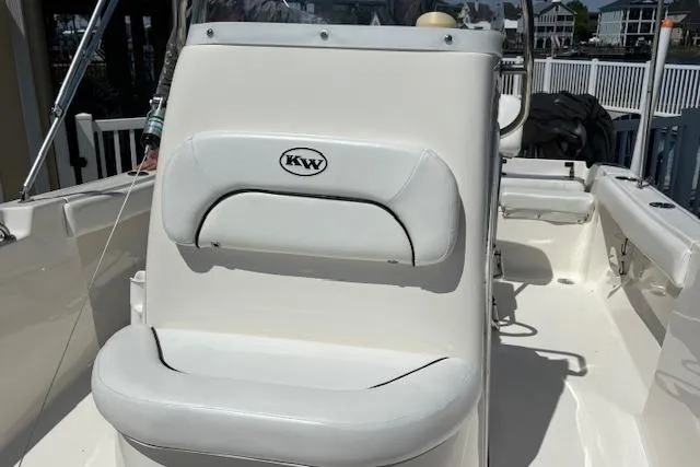 Slide: The Image of 2013 Key West 189 FS boat interior with white seating and console. - 20
