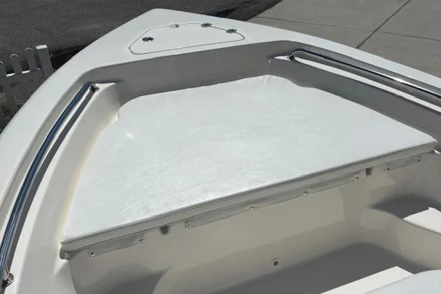 Slide: The Image of 2013 Key West 189 FS boat bow with sleek white deck and stainless steel rails. - 21