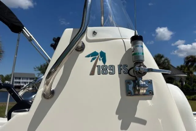 Slide: The Image of 2013 Key West 189 FS boat console with logo and clear sky background. - 5