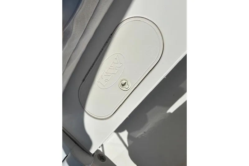 Slide: The Image of Key West 189 FS 2013 boat compartment with KW logo and latch. - 9