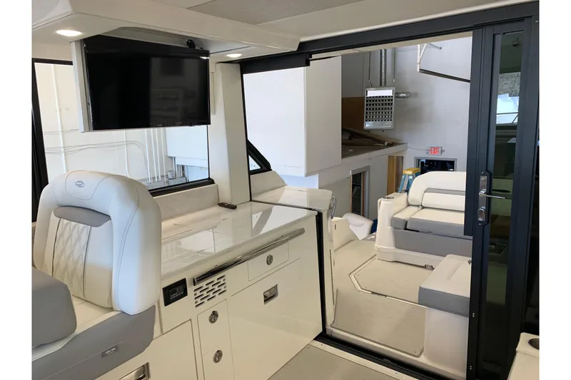 Slide: The Image of Luxurious interior of 2024 Regal 36 Grande Coupe with modern seating and TV. - 10
