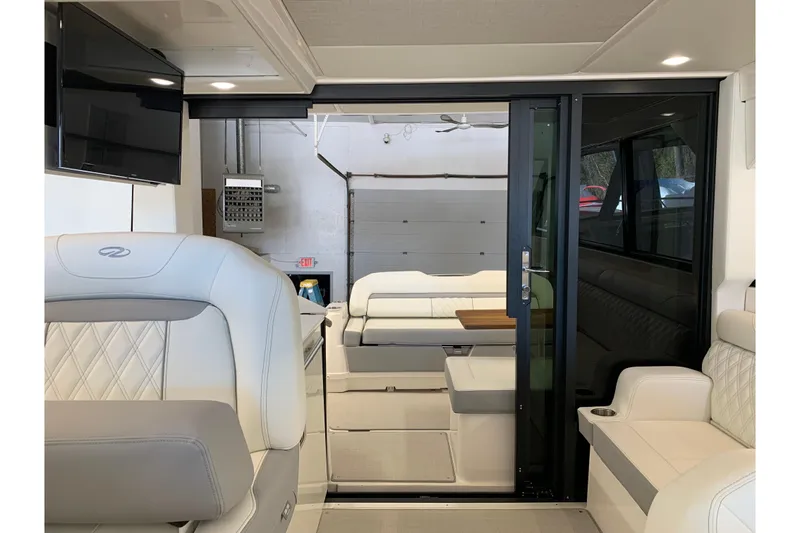 Slide: The Image of Interior of 2024 Regal 36 Grande Coupe, featuring luxurious seating and modern design. - 11