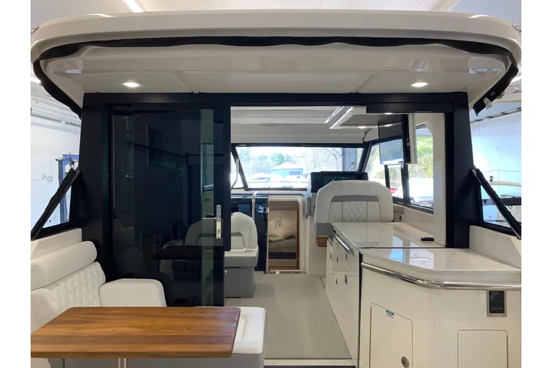 Slide: The Image of Interior of 2024 Regal 36 Grande Coupe yacht, featuring modern seating and sleek design. - 12