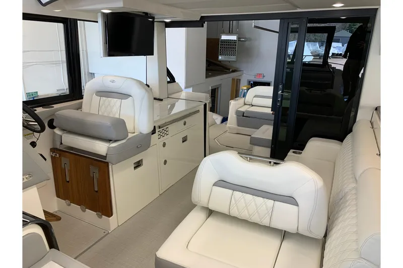 Slide: The Image of 2024 Regal 36 Grande Coupe interior with luxurious seating and modern amenities. - 17
